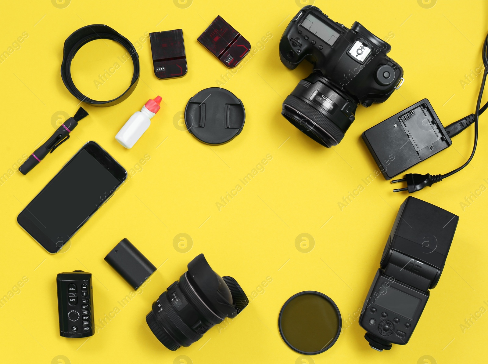 Photo of Flat lay composition with professional photographer equipment and space for text on color background