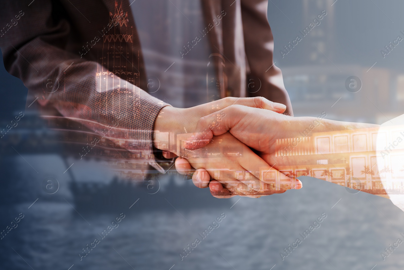 Image of Double exposure of partners shaking hands and cityscape