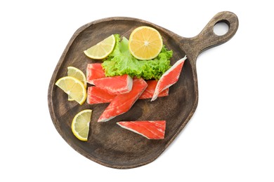 Photo of Serving plate with cut crab sticks on white background, top view