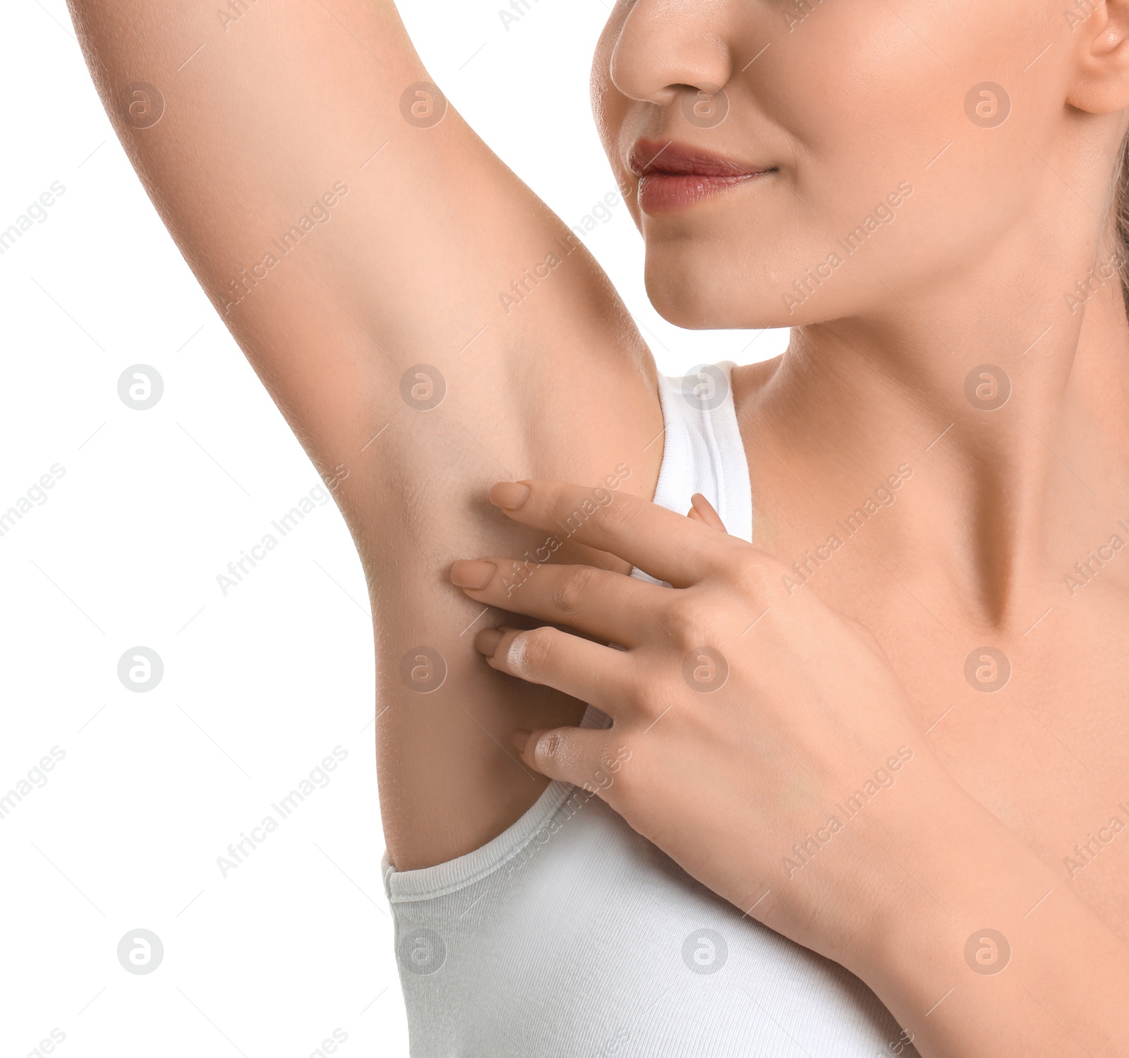 Photo of Young woman showing armpit with smooth clean skin on white background, closeup