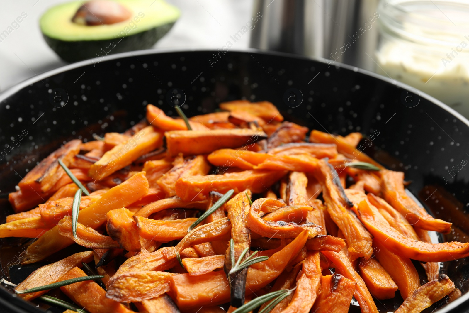 Photo of Dish with baked sweet potato slices, closeup