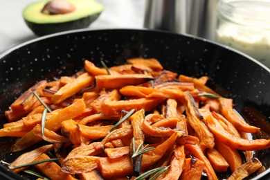 Dish with baked sweet potato slices, closeup