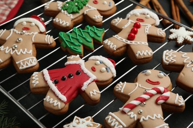 Delicious Christmas cookies on black table, closeup