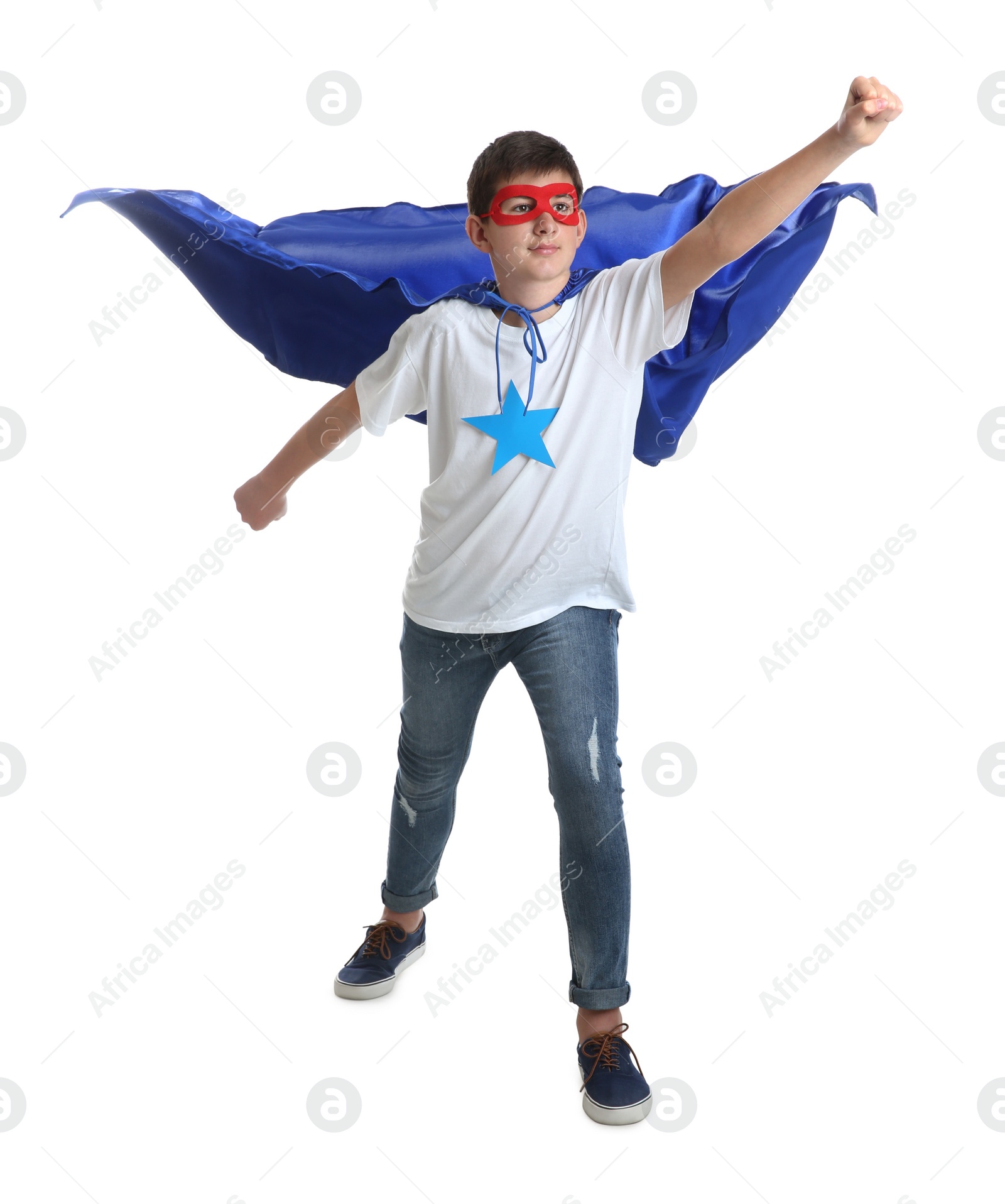 Photo of Teenage boy in superhero costume on white background