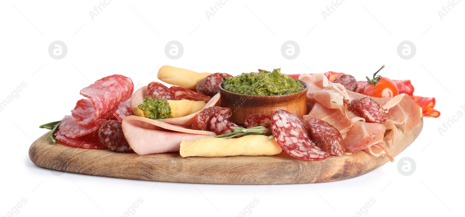 Photo of Wooden board with tasty ham and other delicacies isolated on white