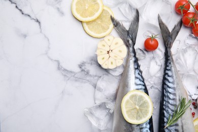 Photo of Flat lay composition with tasty raw mackerel on white marble table. Space for text