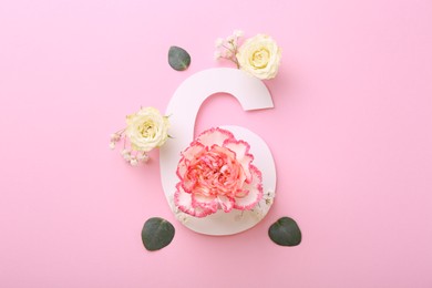 Photo of Paper number 6, eucalyptus leaves and beautiful flowers on pink background, flat lay