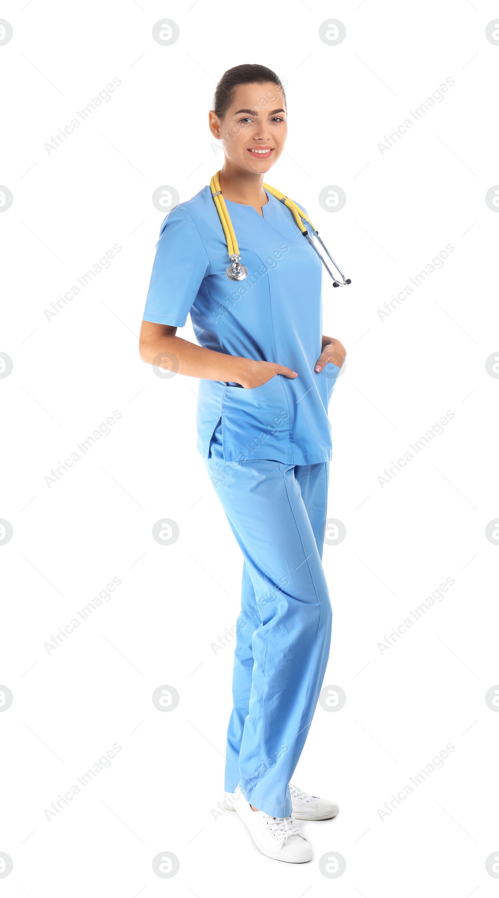 Photo of Full length portrait of young medical assistant with stethoscope on white background