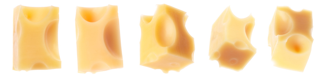Image of Pieces of delicious cheese on white background, banner design