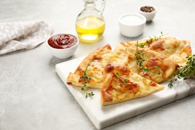 Photo of Delicious khachapuri with cheese on light table