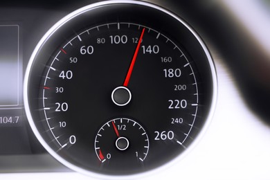 Image of Speedometer on car dashboard, closeup. Motion blur effect