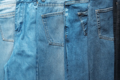 Photo of Jeans of different colors as background