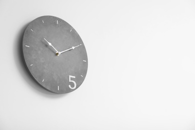 Photo of Stylish clock on white background. Time concept