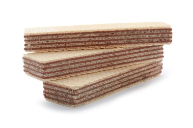 Photo of Delicious crispy wafers on white background. Sweet food