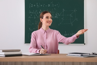 Photo of Portrait of young female teacher in classroom