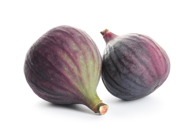 Photo of Whole ripe purple figs on white background