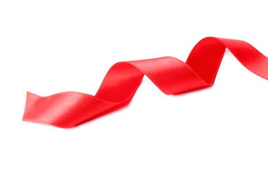 Photo of Simple red ribbon on white background. Festive decoration