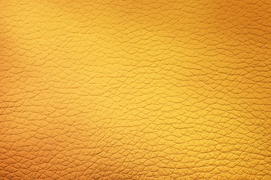 Image of Golden textured surface as background, closeup view