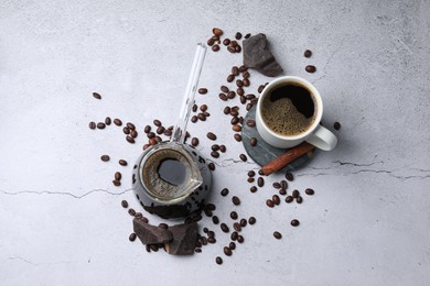 Photo of Turkish coffee. Flat lay composition with cezve and beans on light grey table