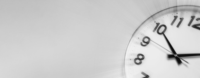 Image of Fleeting time concept. Clock on light grey background, motion effect. Banner design with space for text