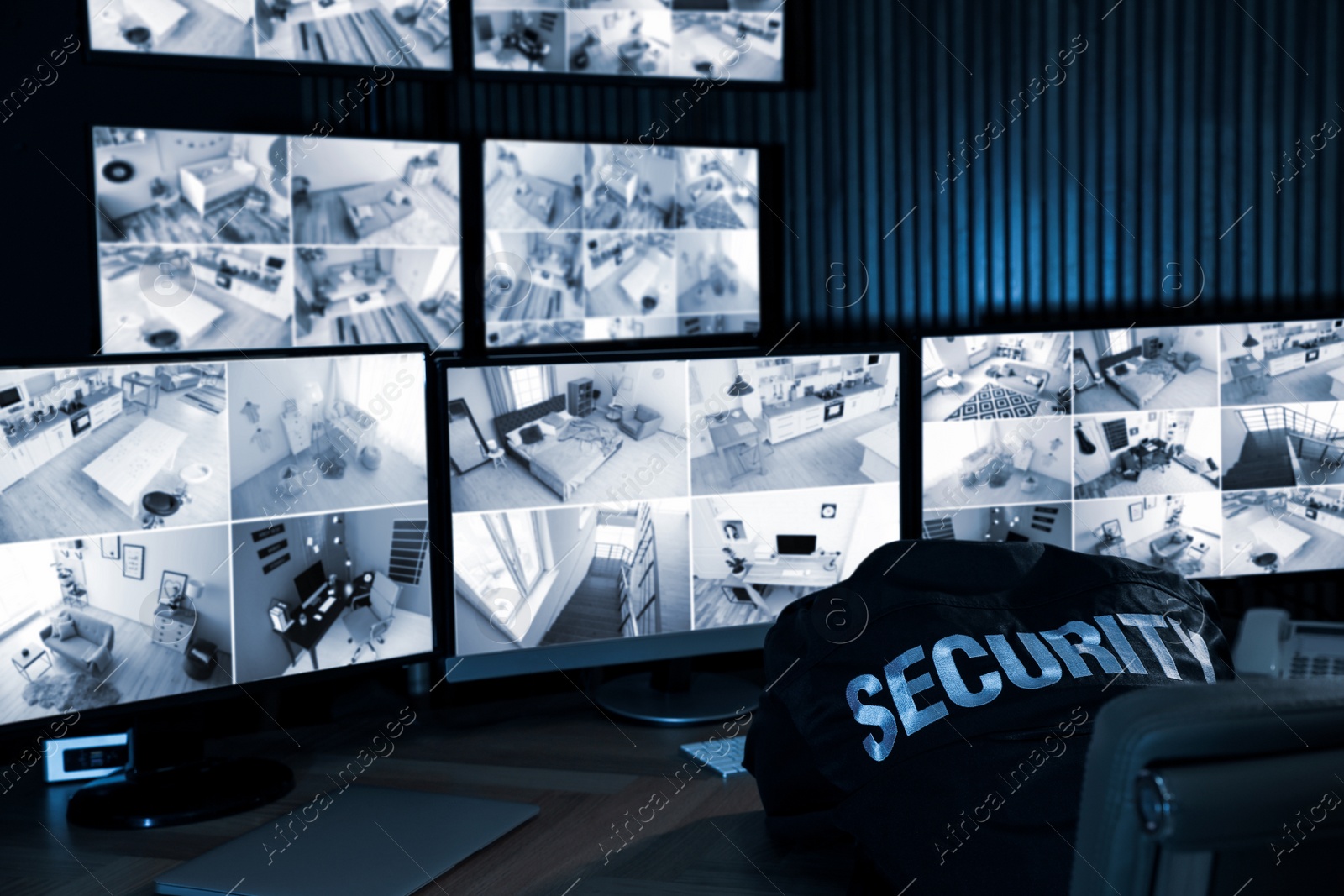 Photo of Tired security guard sleeping in office at night