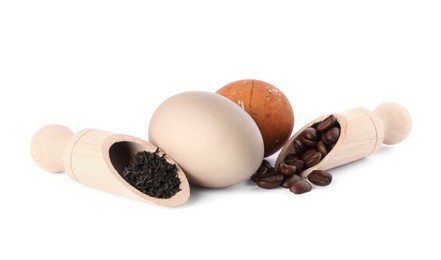 Photo of Naturally painted Easter eggs on white background. Tea and coffee beans used for coloring