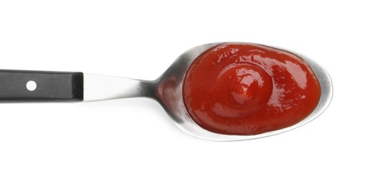 Photo of Tasty ketchup with spoon isolated on white, top view. Tomato sauce