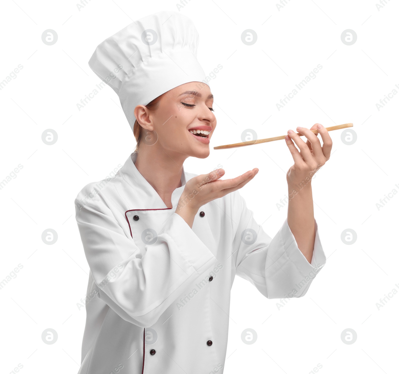 Photo of Happy chef in uniform tasting something on white background