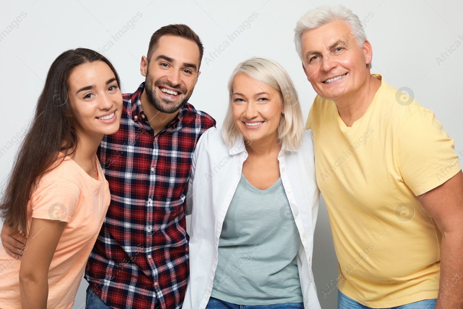 Photo of Portrait of happy family on white background