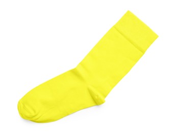 Photo of New yellow sock isolated on white, top view