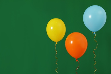 Bright balloons on color background, space for text. Celebration time