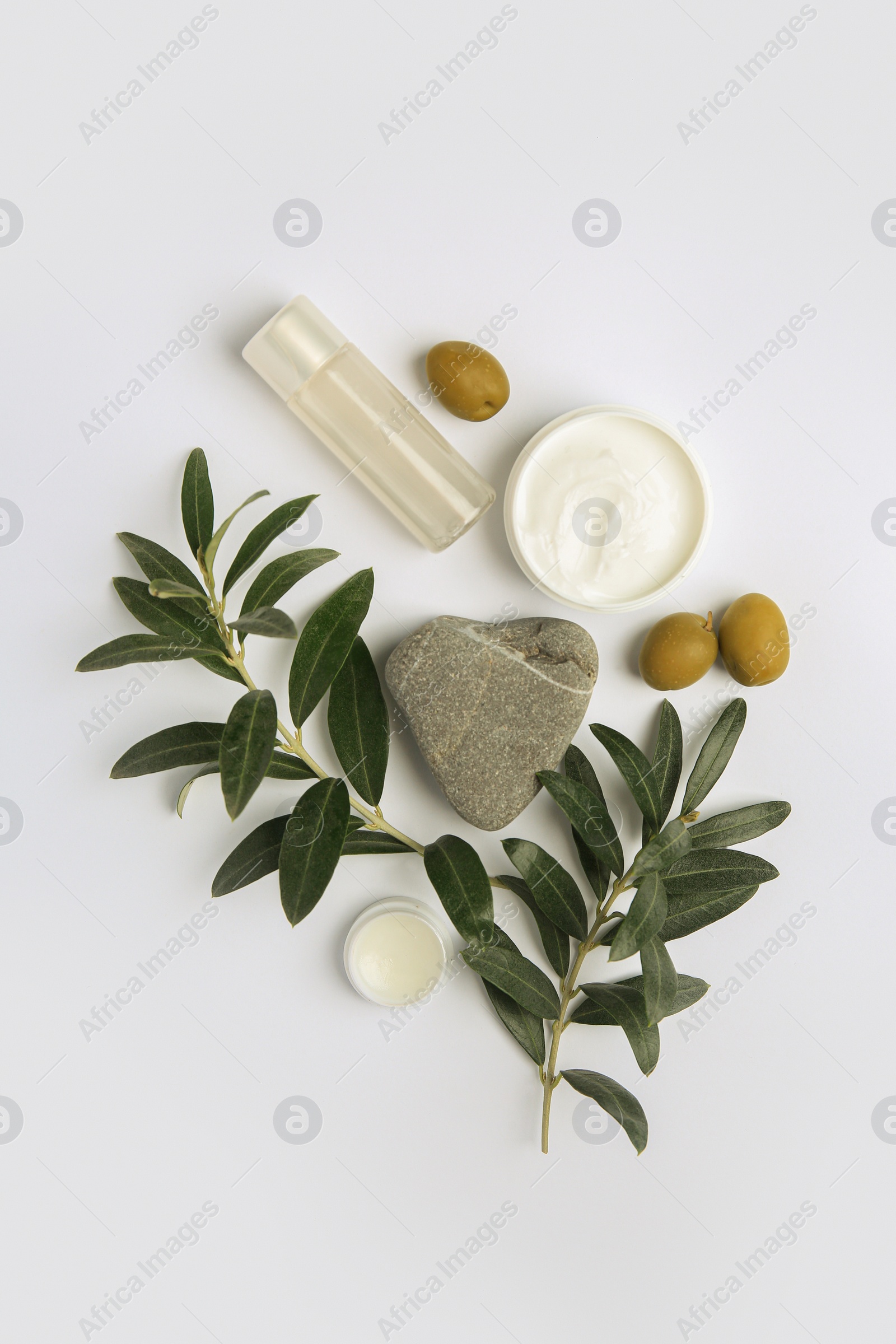 Photo of Flat lay composition with different cosmetic products and olives on white background