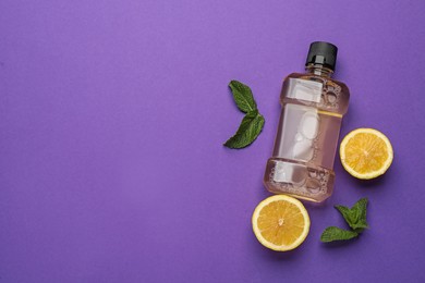 Photo of Mouthwash, fresh mint and lemon on purple background, flat lay. Space for text