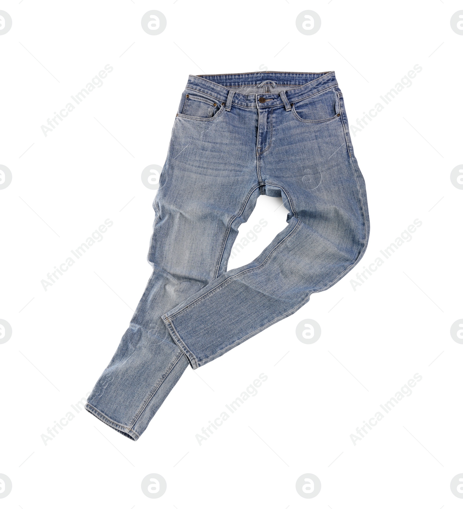 Photo of Stylish light blue jeans isolated on white, top view