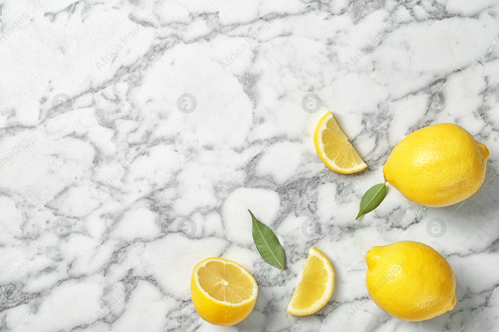 Photo of Flat lay composition with lemons on marble background