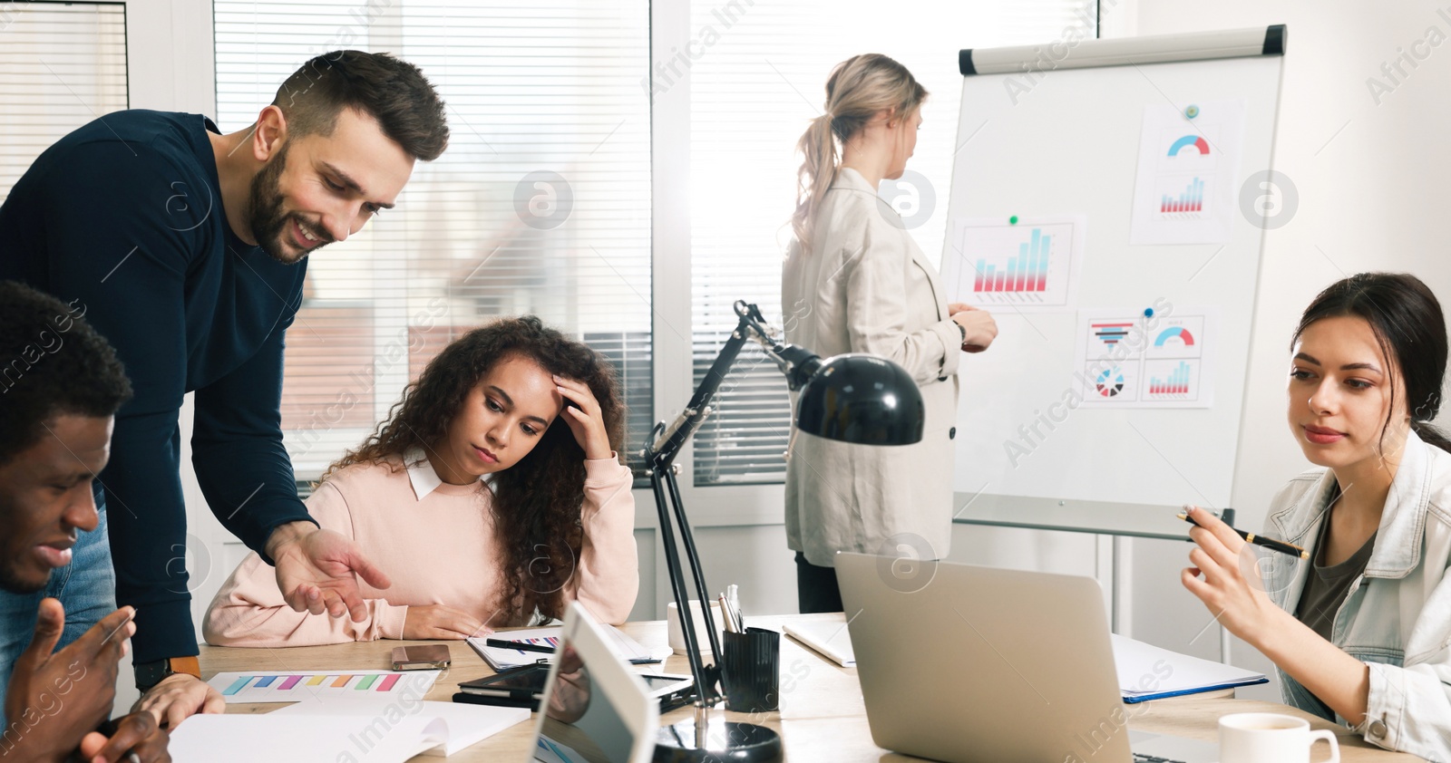 Image of Group of coworkers together in office. Banner design