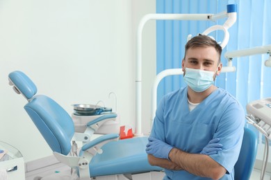 Photo of Portrait of professional dentist at workplace in clinic