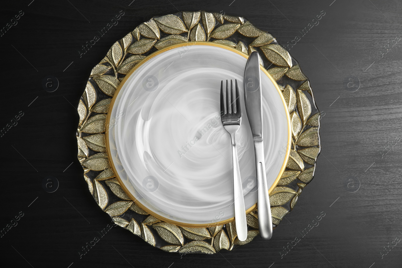 Photo of Elegant table setting on dark background, top view