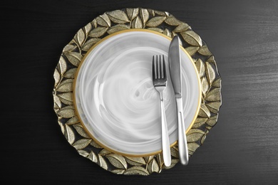 Elegant table setting on dark background, top view