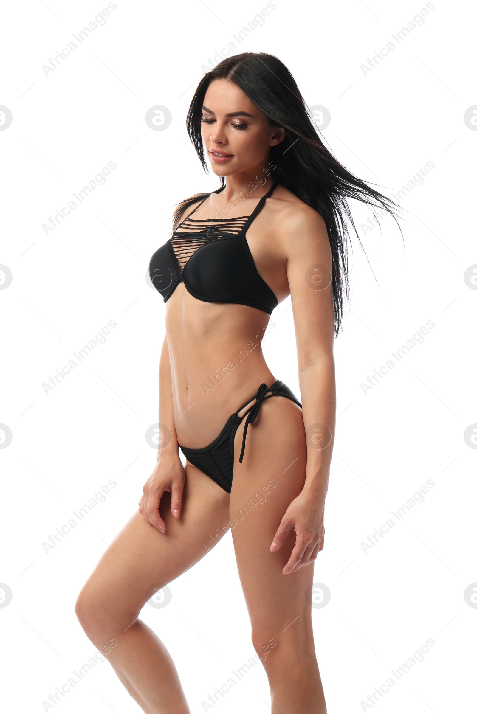 Photo of Beautiful young woman in black bikini on white background