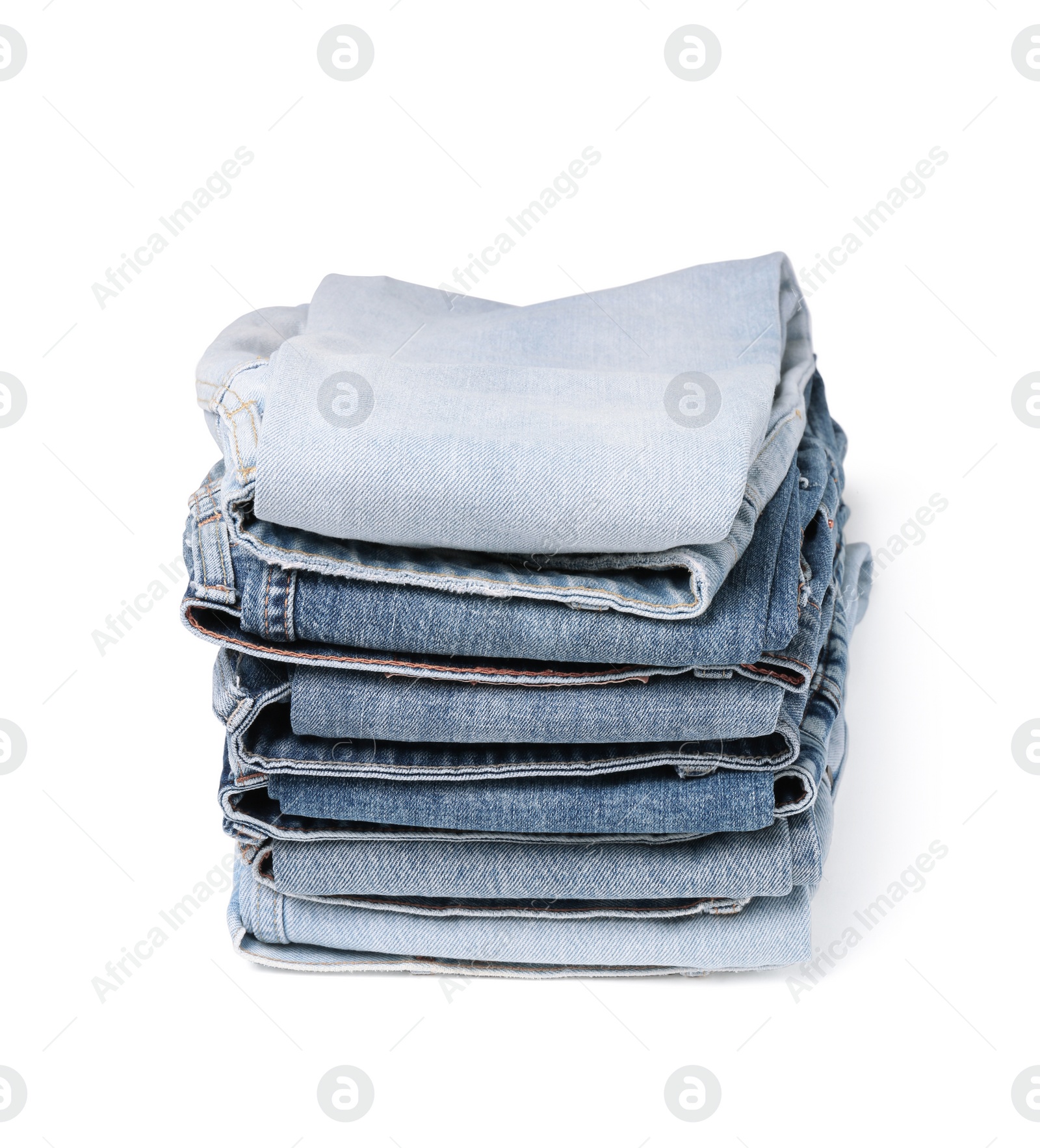 Image of Stack of different folded jeans isolated on white