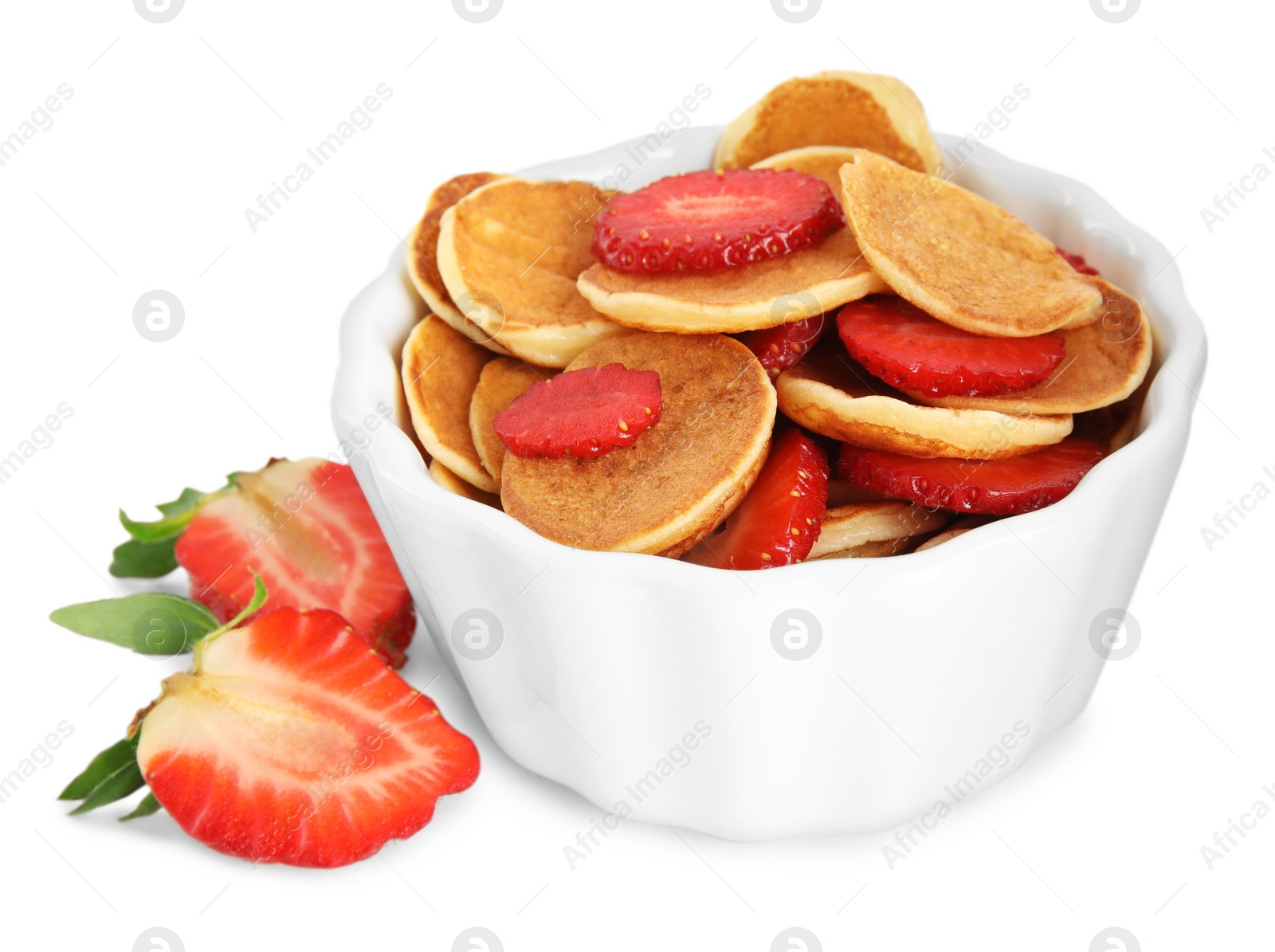 Photo of Delicious mini pancakes cereal with strawberries on white background