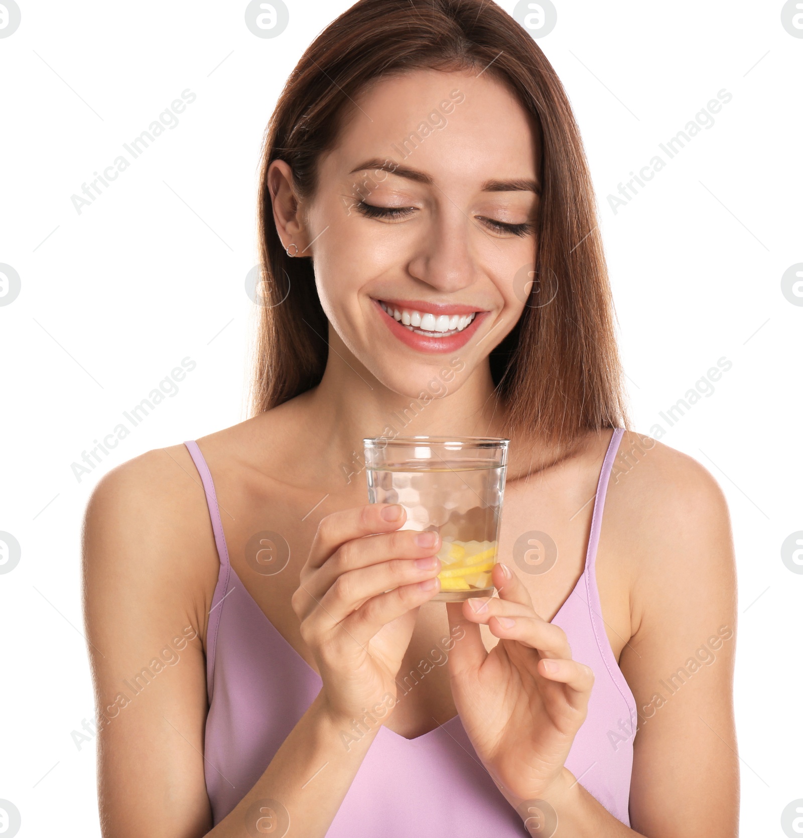 Photo of Young woman with glass of lemon water on white background