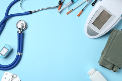 Photo of Flat lay composition with different medical objects and space for text on color background