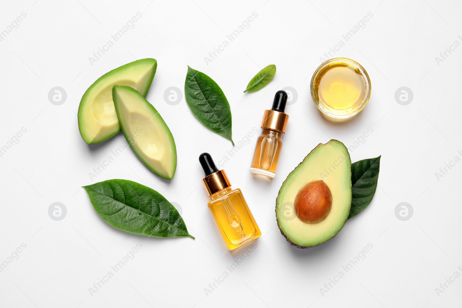 Photo of Flat lay composition with essential oil and avocado on white background