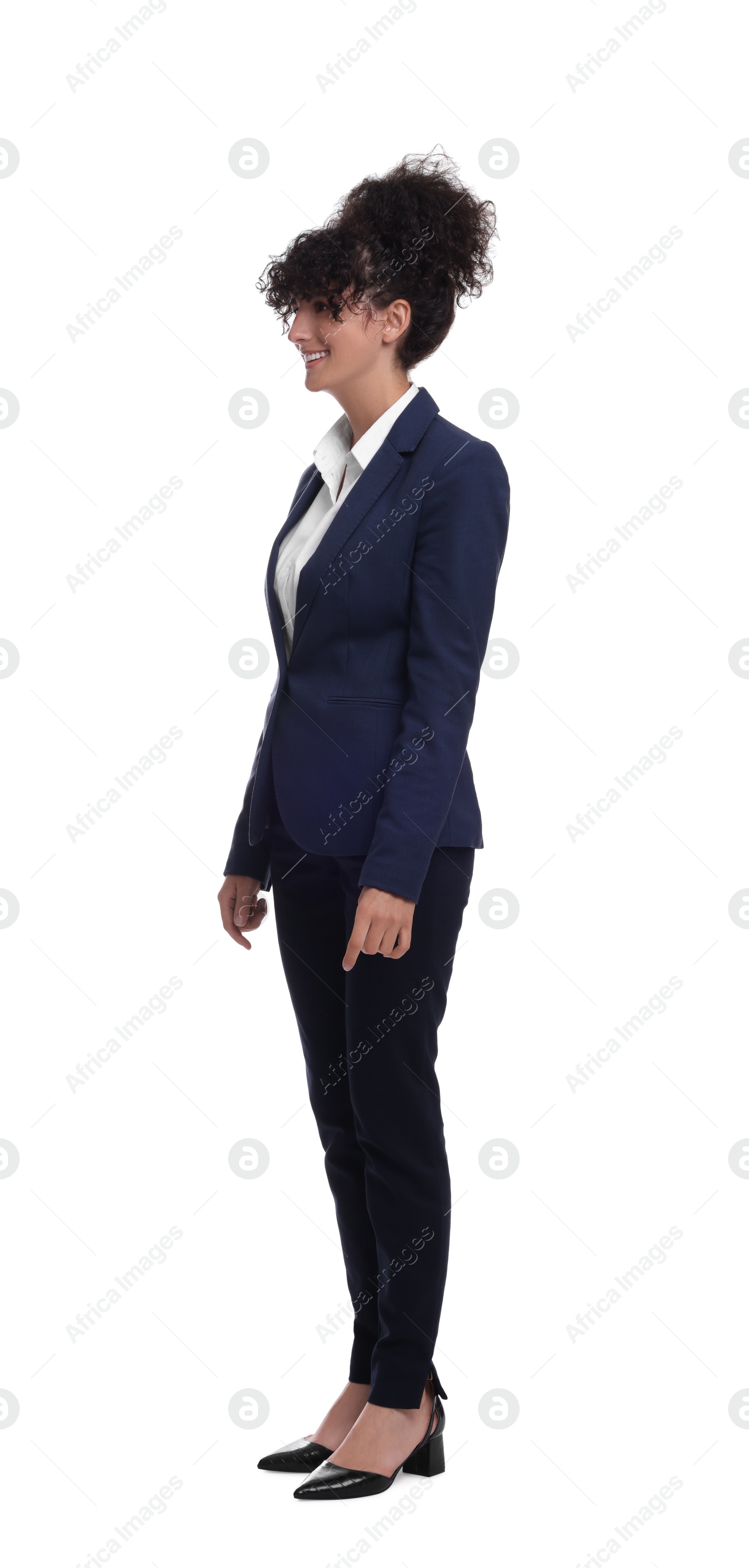 Photo of Young businesswoman in suit standing on white background