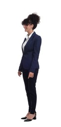 Young businesswoman in suit standing on white background