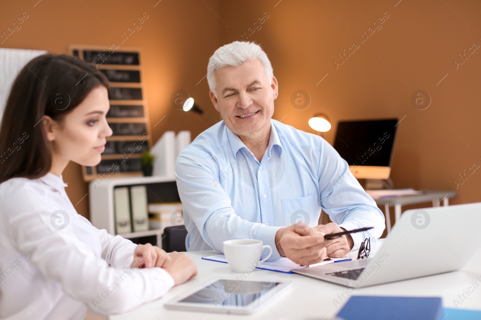 Photo of Human resources manager conducting job interview with applicant in office