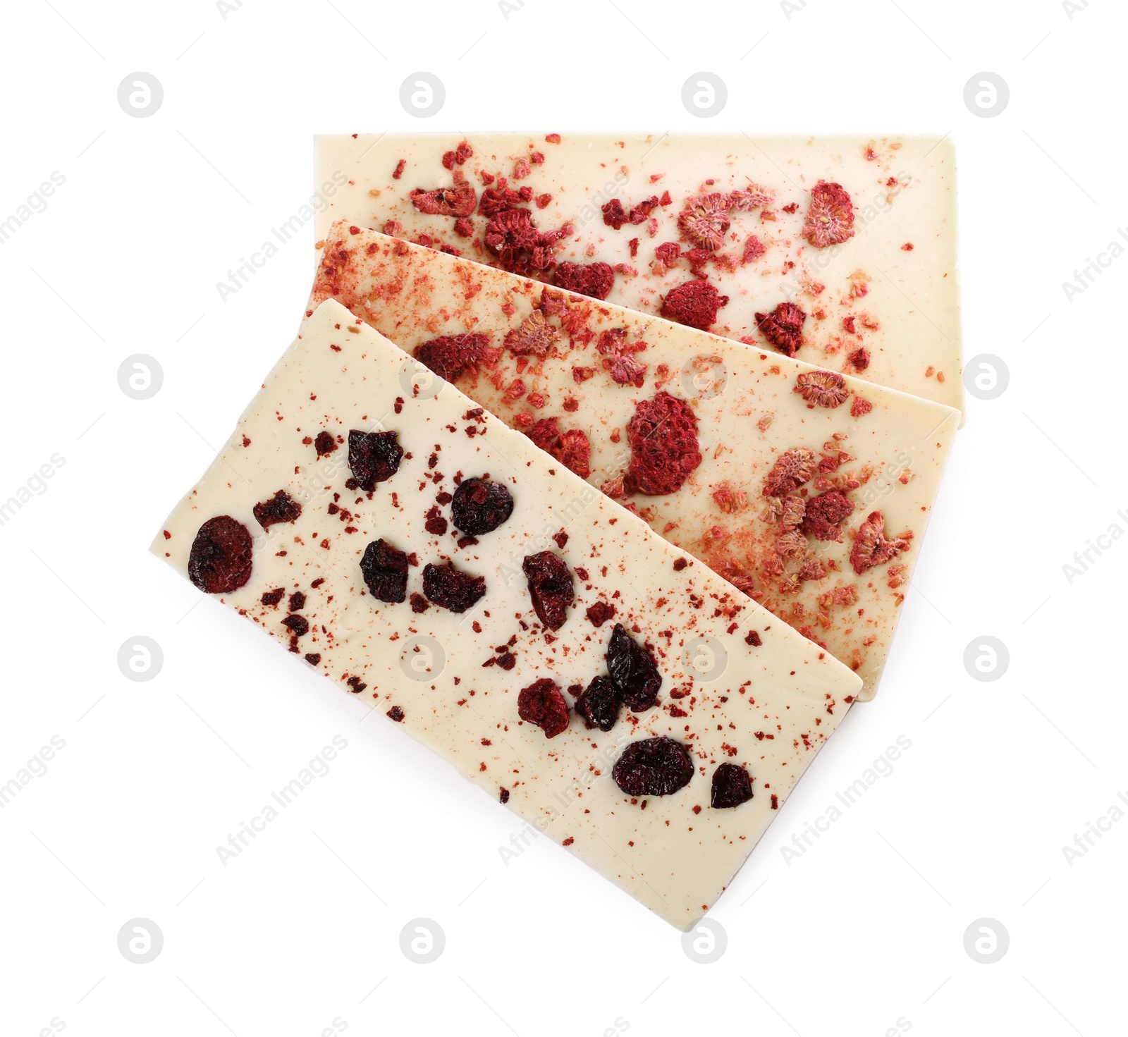 Photo of Chocolate bars with freeze dried berries on white background, top view