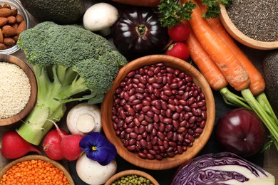 Photo of Different vegetables on table, flat lay. Vegan diet